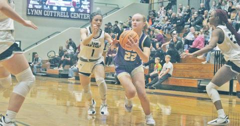 Lumpkin’s Anna Davis goes in for a layup against Chestatee. 
