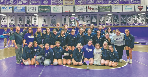 The Lumpkin County Girls Wresting Team celebrates its Area Championship victory.
