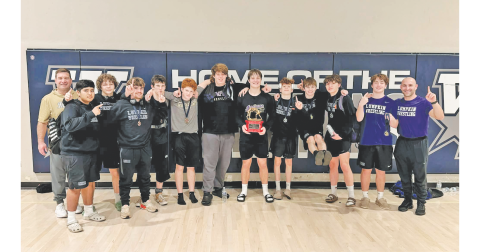 The Lumpkin County boys wrestling team celebrates its first place win at the Spartan Slam.