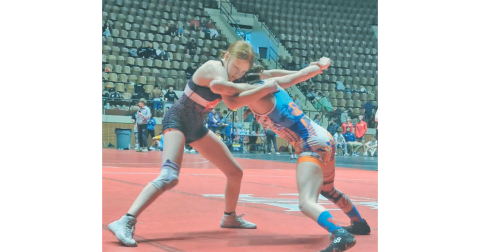 Allie Proctor (left) looks for an opening in her opponent’s defense during competition.