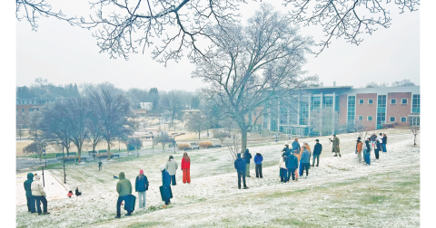 Students at the University of North Georgia made the most of the snow and ice mix over the weekend as they turned the hill in front of the library into a sledding zone. (Photo by Natalee Schiffhauer)