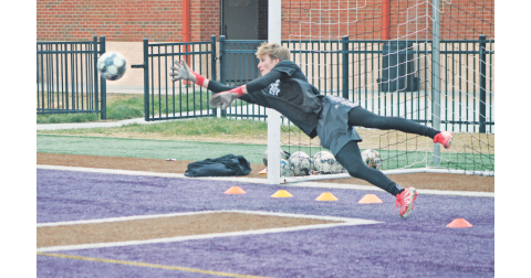 Lumpkin County goalie Chance Sprague dives for a block durning a practice drill.