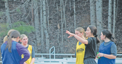 New Lumpkin County Girls Soccer Head Coach Abi Hunt talks things over with her team.