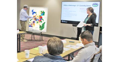 Mayor Sam Norton points to a large map highlighting Dahlonega’s Planned Unit Development zones during last month’s City Retreat.