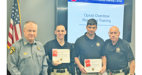 Sheriff Stacy Jarrard, far left, and Major Doug Cochran, far right, present the LCSO Life Saving Award to Sgt. Tristan Burnett, left, and Deputy Daniel Garguilo during a special meeting last month.