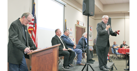 Lumpkin County Republican Party Chair and forum moderator Mark Page (left) reviews his notes as District 9 state House candidate Wayne Rowan speaks to voters. Seated behind Rowan are fellow House candidates (from left) Doug Sherrill, Chris Dockery and Roger Smith.