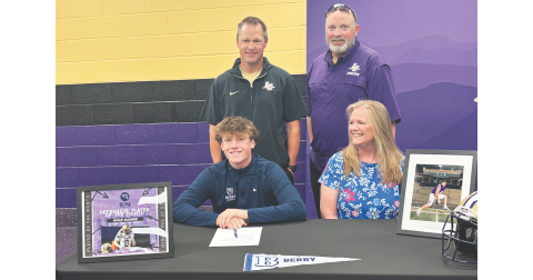 Lumpkin senior Wolf Harbin celebrates his college commitment with his mom and coaches.