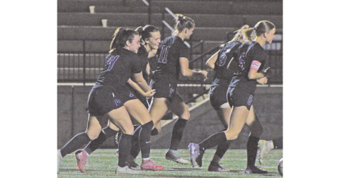 Sophia Manisy and Carlie Fugich celebrate a Lumpkin County goal together.