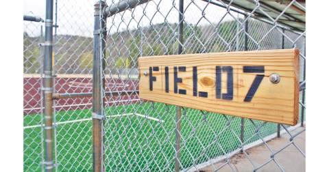 New signage hangs on the entrance to the Field 7 dugout, one of four Clover Leaf fields that have re-opened following the addition of artificial turf and other renovations.