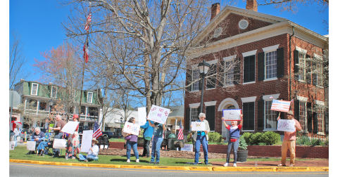 A crowd of local protestors gathered on the Square last Saturday on the lawn next to the Gold Museum.