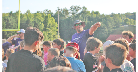Assistant Coach Jake Estenson directs young participants during the recent summer camp.