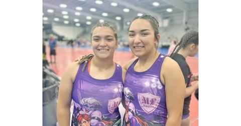 Lumpkin County wrestlers Natalie (left) and Mathiel Mendoza share a fun moment ahead of one of their matches.