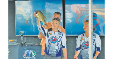 Lyndsey Gailey shows off her catch, alongside her sister Audrey, at the World Championships.
