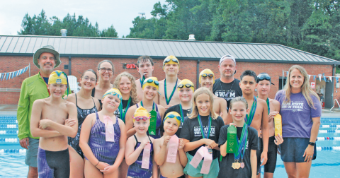 The Lumpkin Parks & Rec swim team gathers for a photo back at home, after their successful performance at State.