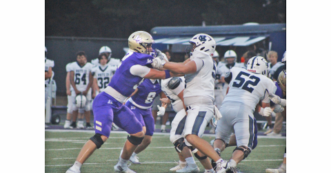 Senior Caleb Soles locks up with a White County lineman during last week’s game.
