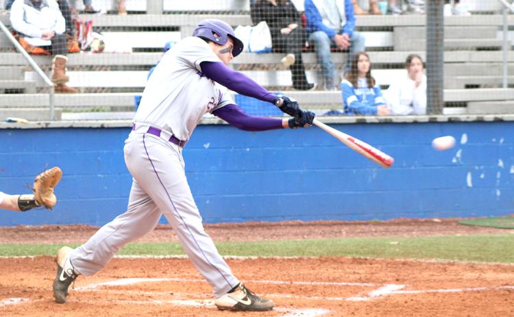 Caleb Childs rips a two-run double down the left field line to give Lumpkin an early 2-0 lead over the Fannin County Rebels. The Indians eventually won the region matchup 5-4 after the game was called due to heavy rain and lightning.
