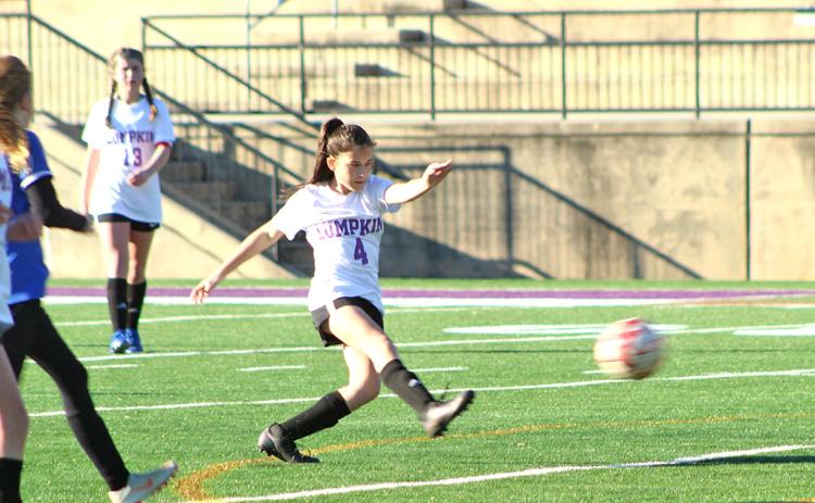 Lumpkin’s Della Marshall boots in one of her two goals in Lumpkin’s 10-0 win over the Fannin County Lady Rebels last week.