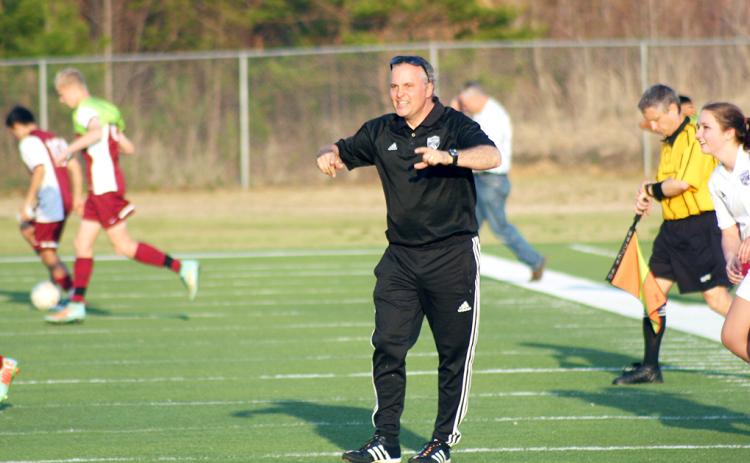 Don Brock cheers on his players after a victory over rival Dawson County. The long-time LCHS girls soccer coach’s career was recognized recently when he was named to Blitz’s Legendary Coaches list.