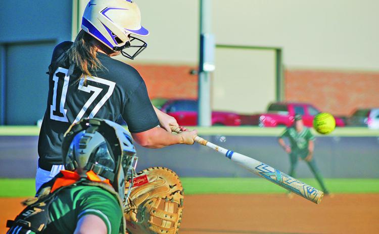 Lumpkin’s sophomore catcher Natalie Shubert smashes a pitch against North Hall during last week’s 3-1 victory.
