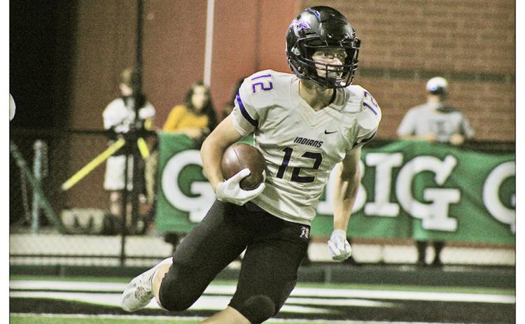 Caleb Norrell carries the ball during a kickoff return against North Hall on Friday. Norrell led the Indians with five receptions for 102 yards and a touchdown as the first Lumpkin receiver to have over 100 yards in one game since Austin Pierce in 2015.