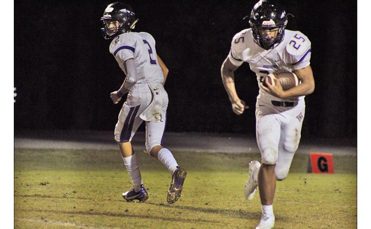 Freshman quarterback Harper Davenport looks for an open reciever downfield in Lumpkin’s game last week.
