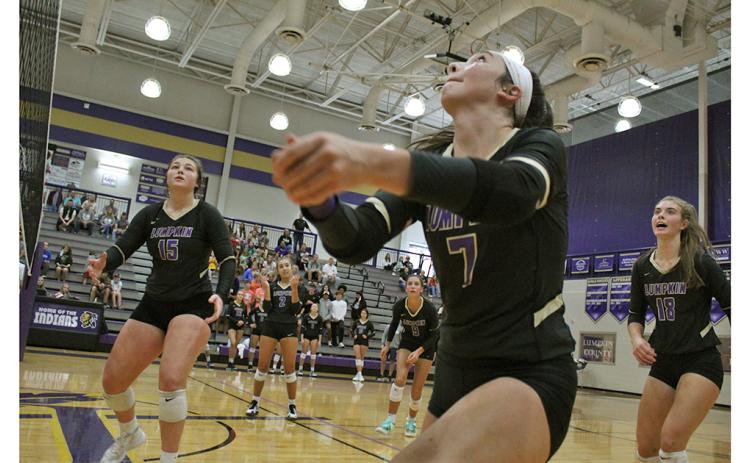 Addie Rucker focuses in to get a perfect set while teammates Reagan Spivey, Isabel Davenport, Kiersta Trammell and Victoria Crotzer look to react in time to get the ball back over the net during Lumpkin’s second round playoff match.