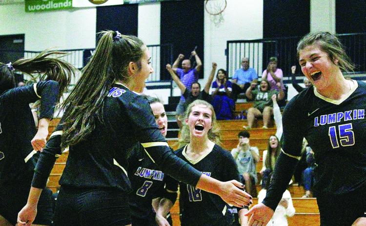 The Lumpkin County varsity volleyball team celebrates a winning point versus White County. The victory helped the Lady Indians clinch a spot in the State Tournament.