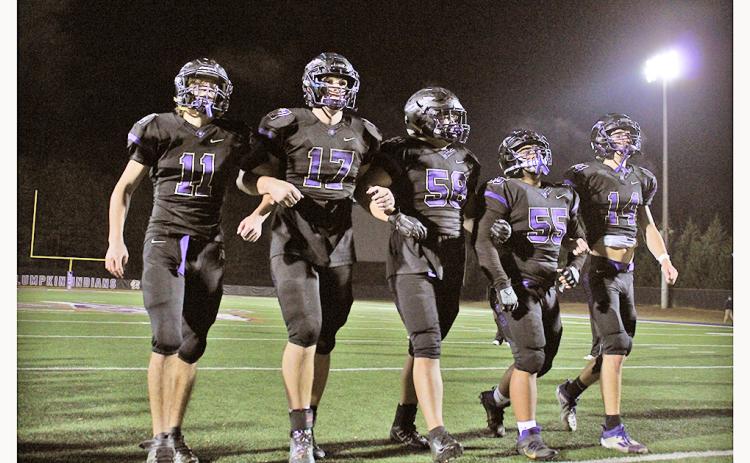 LCHS football seniors (from left) Tanner Kirk, Drew Allison, Joseph Thomas, JoJo Allison and Jared Hoch walk off the field together one final time, following their final game on Friday.