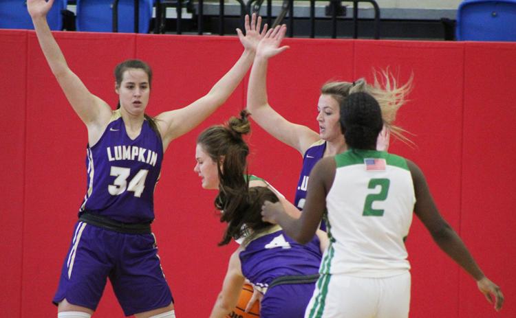 The Lady Indians defense was stout in their game against Franklin County as MaKenzie Caldwell (left) and Madison Powell put pressure on the ball-handler in hopes of forcing a turnover. The suffocating Lumpkin defense allowed only 20 points in its tournament finale, walking away with a 2-1 record to start the season.