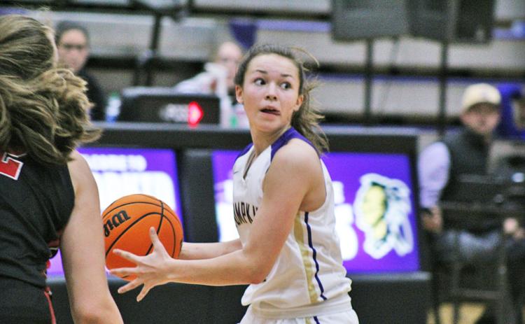 Freshman guard Averie Jones dribbles down the court looking to find an open teammate with a pass during Friday’s loss to Cherokee County. The Cherokee defense kept the Indians under intense pressure all night, making things difficult on the offensive end.