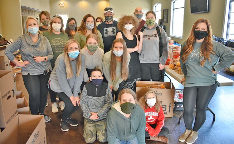 Many volunteers helped distribute Thanksgiving meals to local families in need.