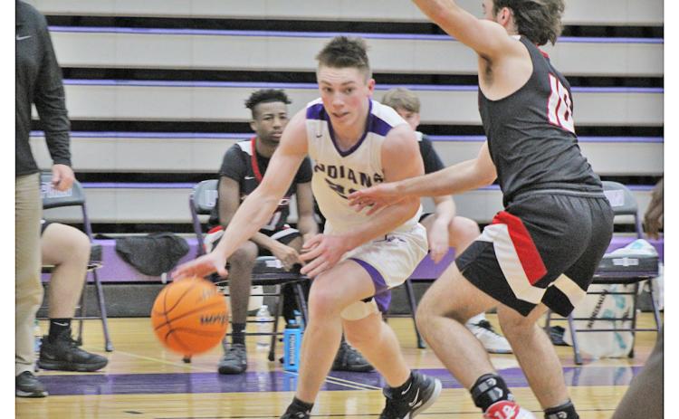 Senior point guard Gus Faulkner drives past a defender during Lumpkin’s game against Flowery Branch on Friday, Jan. 15. Faulkner led the scoring in both games last week, scoring 26 points in Tuesday’s loss to White County followed by a 22-point performance in the team’s win against Flowery Branch.