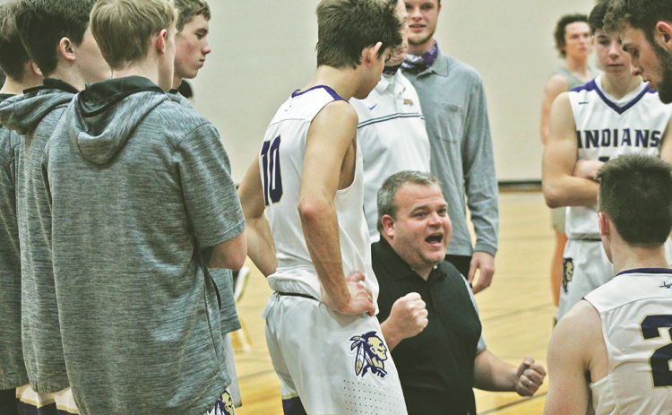 Head coach Michael Parker encourages his team during a timeout in Lumpkin County’s crucial region-win over Gilmer County on Friday. Parker’s team was 9-9 as it headed into yet another crucial region-matchup with North Hall on Tuesday.
