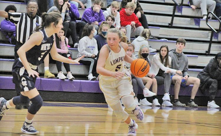 LCHS sophomore Lexi Pierce drives past a defender during Lumpkin’s region game versus White County last Tuesday. The Indians’ one-point overtime loss was their first region loss of the season and only their fourth loss all together this season.