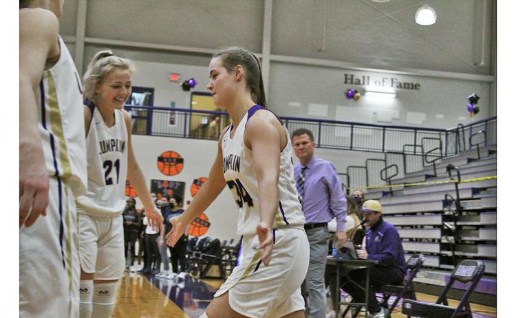 Senior MaKenzie Caldwell is greeted by her teammates as her name is announced with the starting lineup on Senior Night last Tuesday. Caldwell and fellow senior Isabel Davenport represent the first class head coach David Dowse has coached from freshmen to seniors.