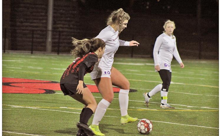 Midfielder Reagan Spivey controls the ball away from her opponent, looking to maintain possession for the Indians.