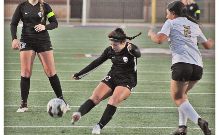 Lumpkin sophomore Nicole Limehouse strikes on goal in Lumpkin’s first action of the season, a scrimmage against East Hall on Thursday.