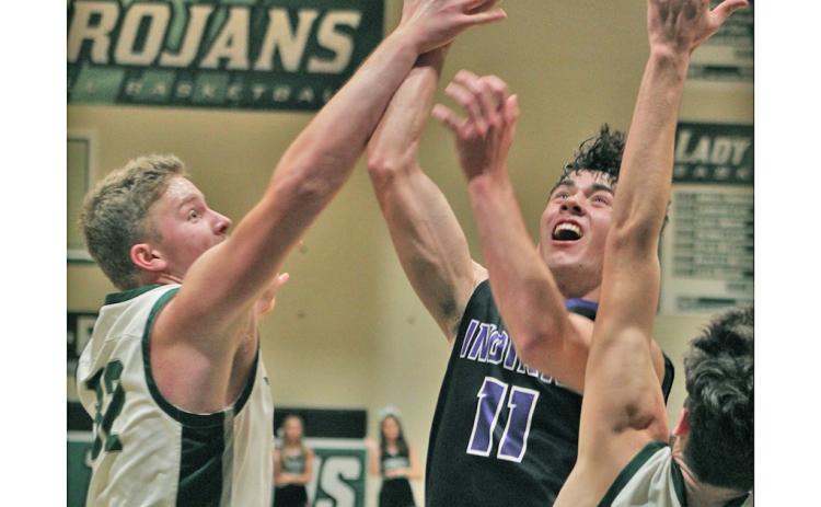 Junior guard Jones Harris puts up a shot in the team’s nail-bitting one-point loss to North Hall on Tuesday. Harris led the team with 19 points despite getting into a bit of foul trouble throughout the game.