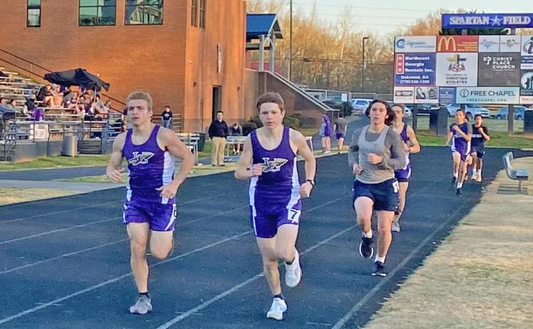 Pictured (from left) Ben Sherrill, Reece Butler and Will Edwards claim first, second and third place in the 1600 Meter Run for the LCHS Track team during its meet at West Hall earlier in the season.