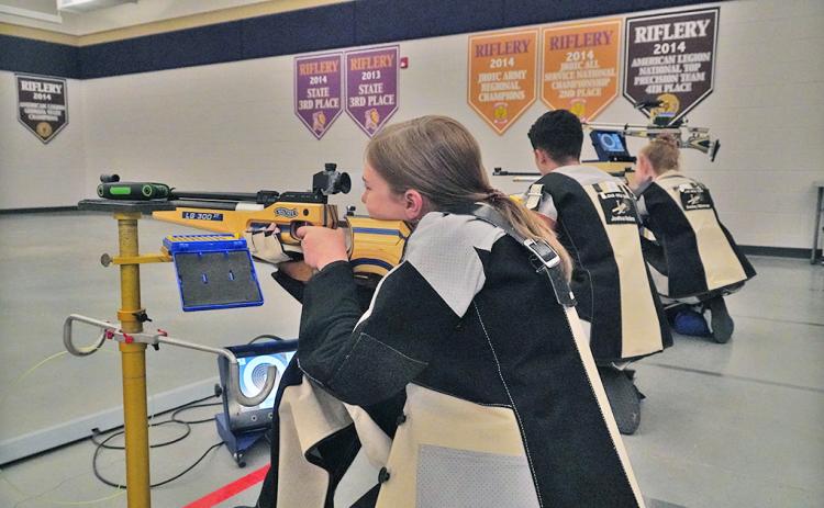 Pictured (from left): Launie Coleman, Joshua Molina and Ansley Gilstrap practice their shooting process before their State Finals appearance. The three, along with Liv Lusky and Maddy Moyer represented the LCHS Rifle team in the GHSA State Rifle Championship where the Indians came away with an eighth place finish.