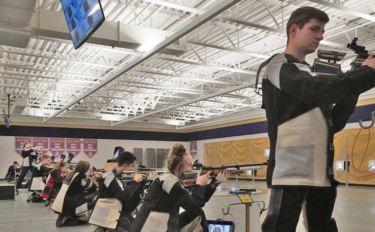 Team Captain Anthony Bauer (right) and the rest of the LCHS Rifle team set their sights on the ultimate prize, a state championship title. The team will be competing at the GHSA Three-Position Air Rifle State Championship on April 24 in Griffin.
