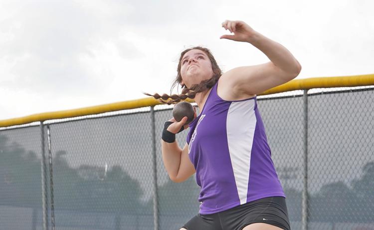 Grace Jones launches her shot put attempt during the Area Track Tournament at White County High School, claiming region champion in the event and qualifying for sectionals.