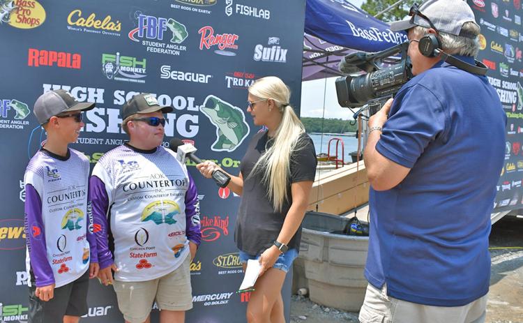 Lumpkin’s Cooper McDonald and Jake Barrett take time for interviews following one of their weigh ins at the High School Fishing National Championships. The tandem represented the LCHS Bass Fishing Team in the National and World Finals, earning a seventh place finish in both events.