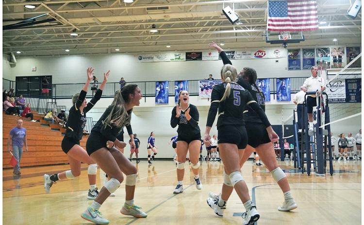 The LCHS Volleyball team celebrates after a massive point in its match versus White County on Thursday. Despite the disappointing start to the season, the team came through with the pressure on to claim its first win of the season against White County, remaining undefeated in region play to begin the year.