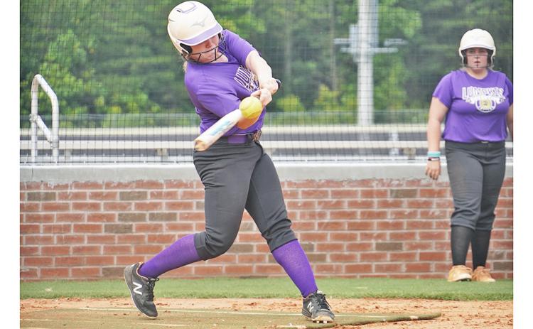 Senior Amma Johnson squares around on a base hit during a recent practice as the LCHS Softball team prepares for its season. Johnson will need to be a key contributor on offense as the team aims to “score in every inning” this season.