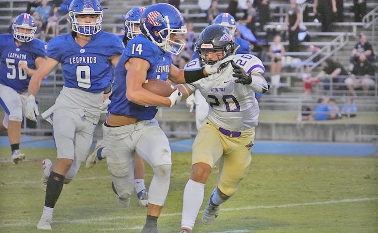 Senior Daniel Brinson goes for a tackle against the Banks County ball carrier during Friday night’s game against the Leopards. The Indians fell 26-16 on the night.