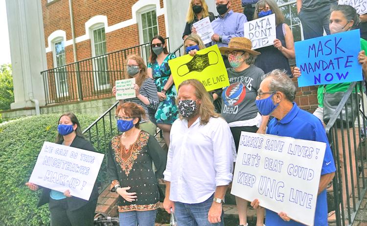 A group of University of North Georgia professors and faculty gathered for a quick rally in favor of a mask mandate being enforced indoors at UNG.