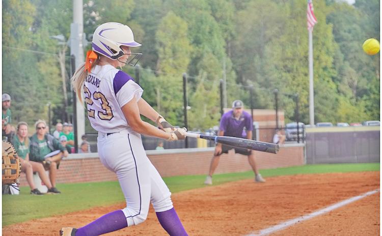 Kelsey Marshall slams a double into the gap in her Senior Night game on Friday against North Hall. Marshall then came around to score one batter later, representing Lumpkin’s lone run of the night, falling 4-1 to the Trojans.