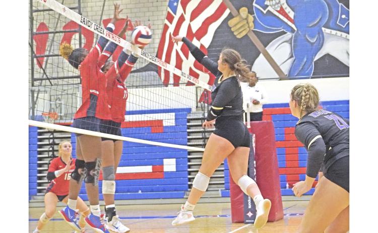 LCHS senior Reagan Spivey attempts to slam the ball past the front wall of Sandy Creek during Lumpkin’s first round state playoff match on Tuesday.