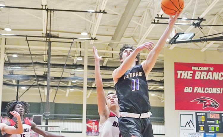 Senior Jones Harris goes up for a layup after successfully driving through the Falcon-filled post. Harris led the Indians with 28 points as the only Indian to score in double digits in the game.